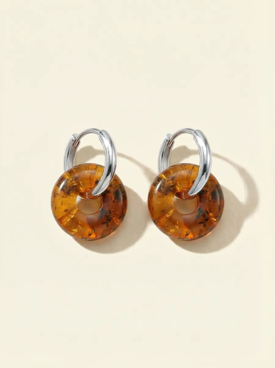 Pair of silver huggie hoop earrings with round amber beads