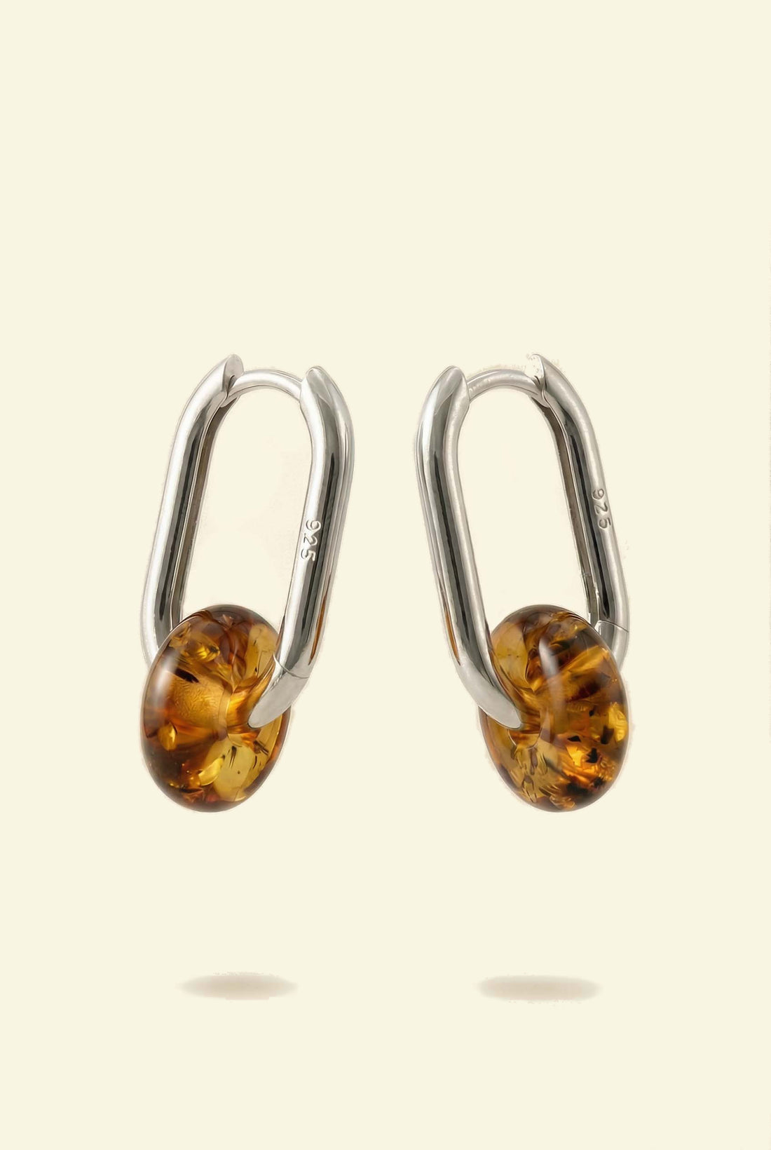 Dune Amber Hoops, pair of silver-tone oval hoops with amber-coloured beads, 925 stamp visible on the hoop