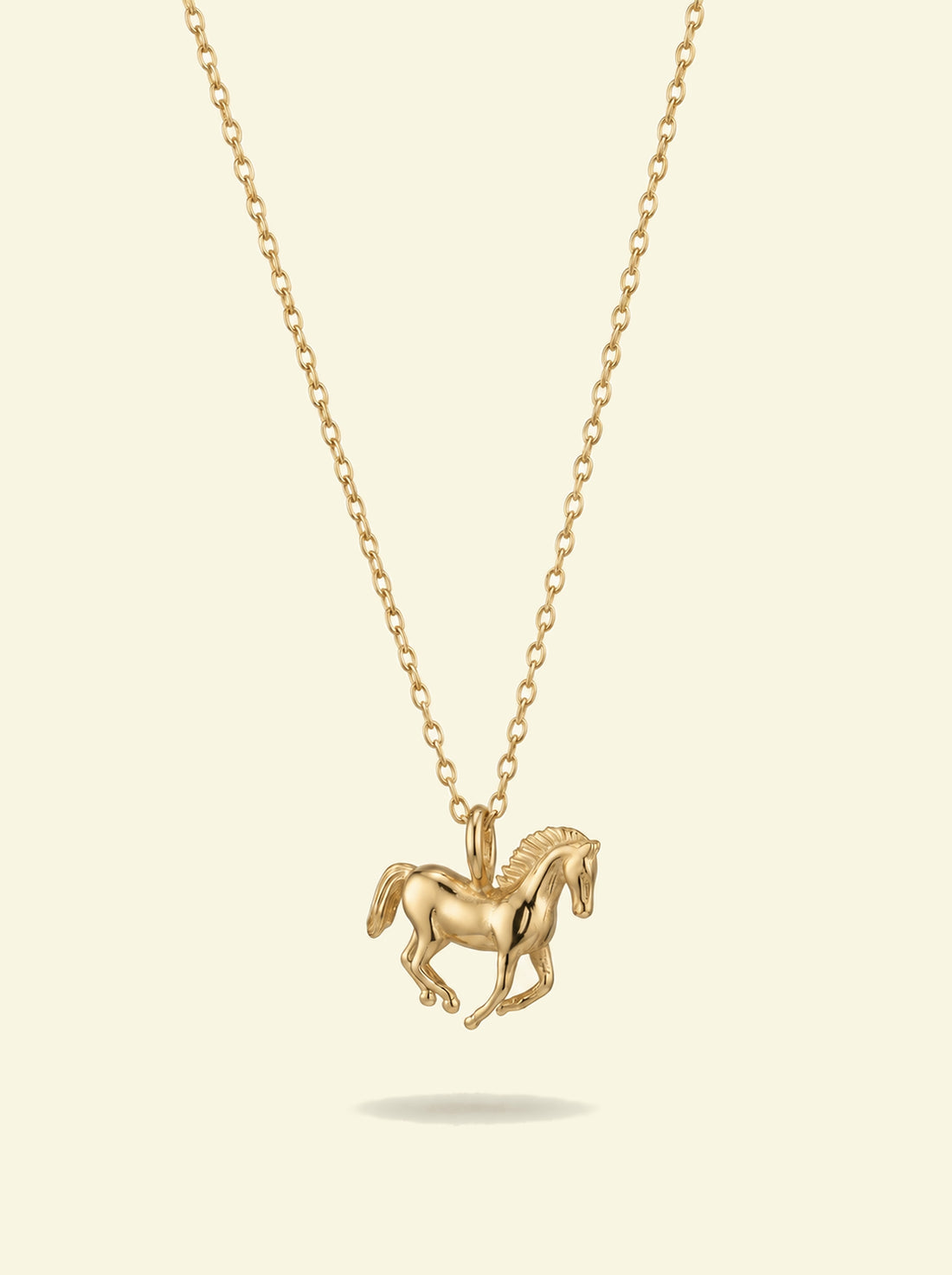 Stallion Pendant, gold-tone galloping horse pendant on a fine cable chain, front view