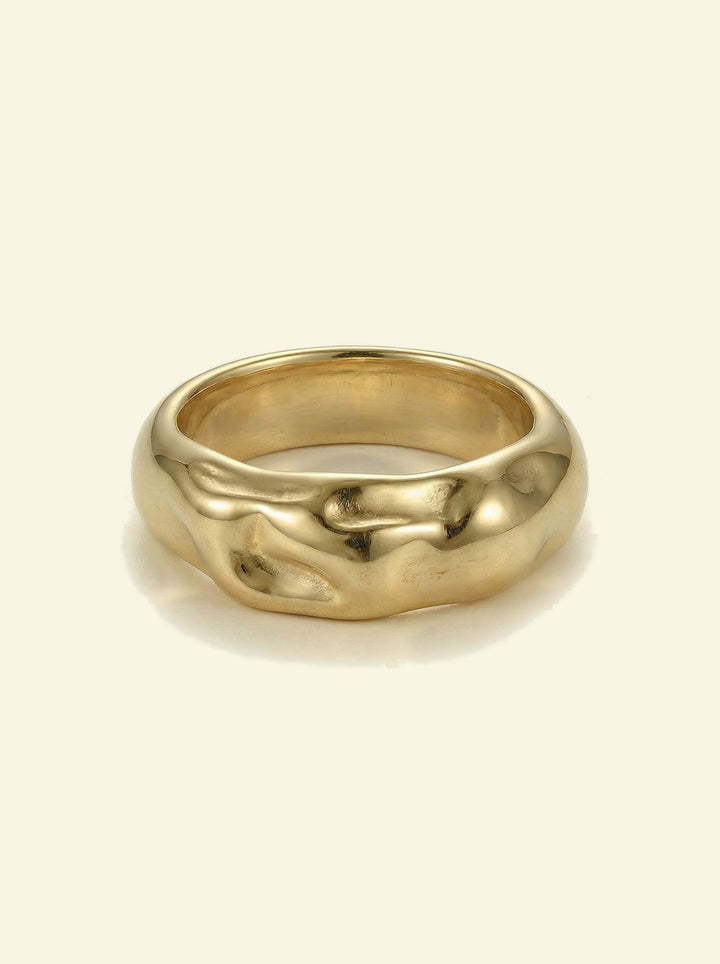 Anvil Ring, chunky gold-tone band with a hammered, molten-looking surface, front view