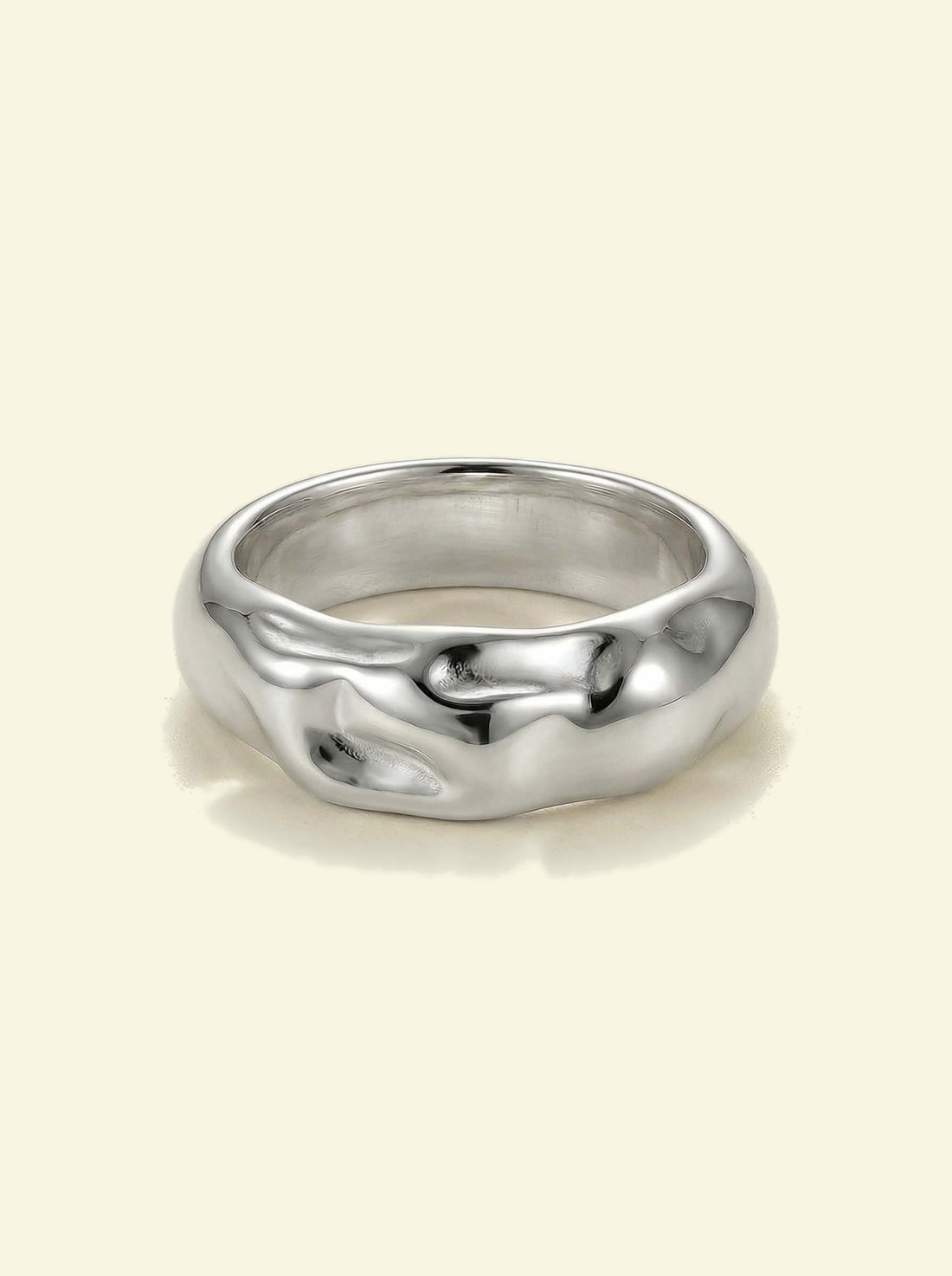 Anvil Ring, silver-tone band with a hammered, molten-looking surface, front view