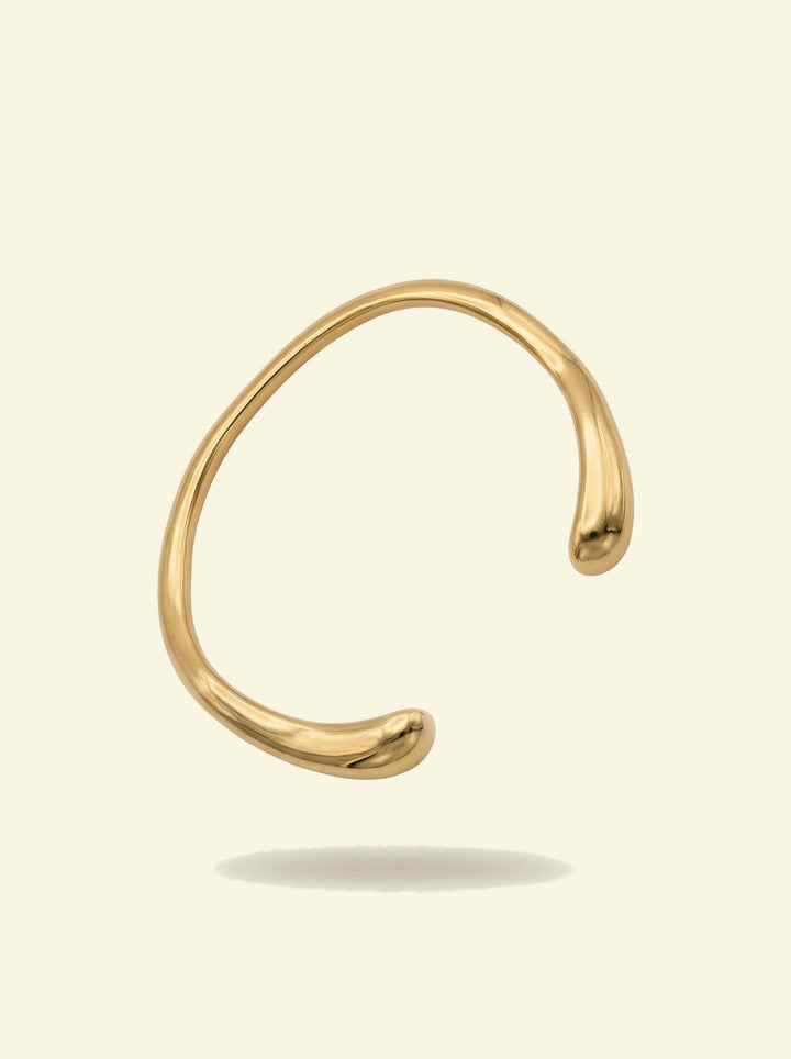 Arc Cuff, gold-tone open cuff with smooth rounded tips, front view