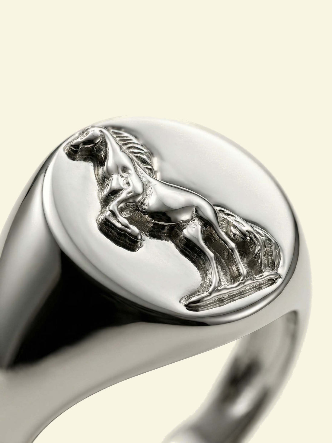 Stallion Signet, macro detail of the rearing horse relief on a silver-tone oval face