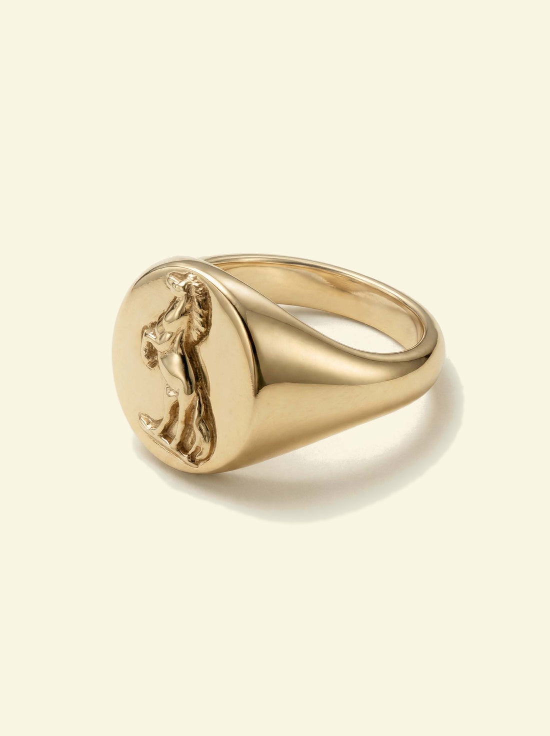 Stallion Signet, gold-tone oval signet ring with a rearing horse in relief, three-quarter view