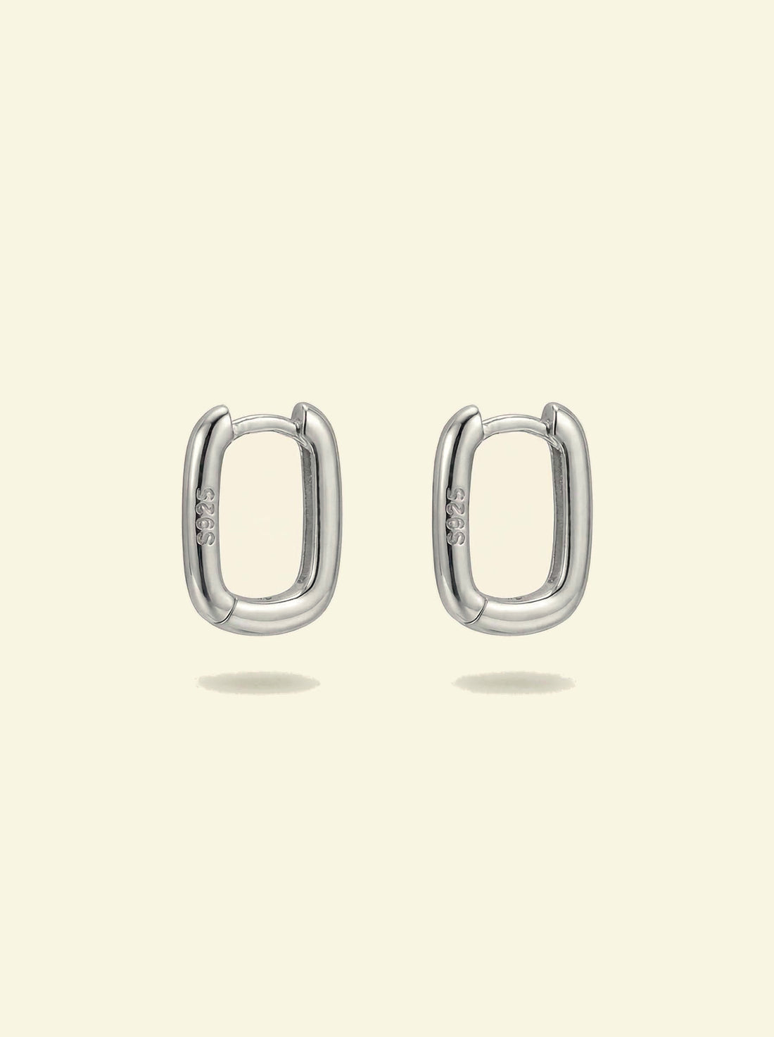 Link Mini Ovals, pair of small silver-tone oval hoop earrings with S925 stamp, front view