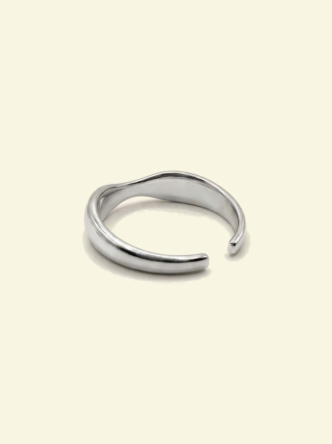 River Ring, silver-tone open band seen from behind, showing the inside of the wave