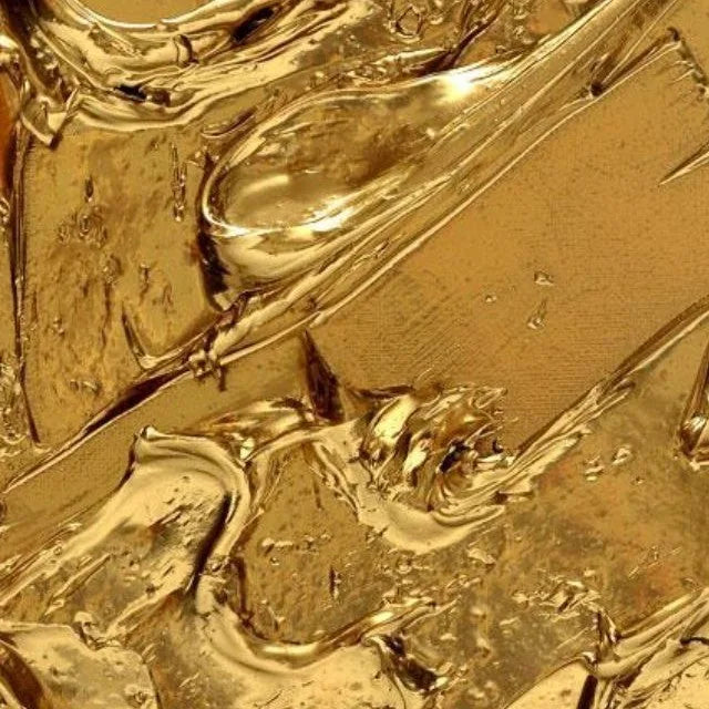 Close-up of rippled, glossy molten gold