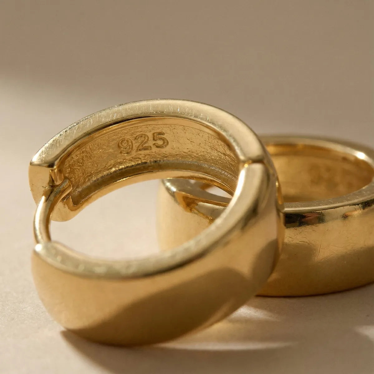 Pair of polished 14K gold-plated huggie hoop earrings
